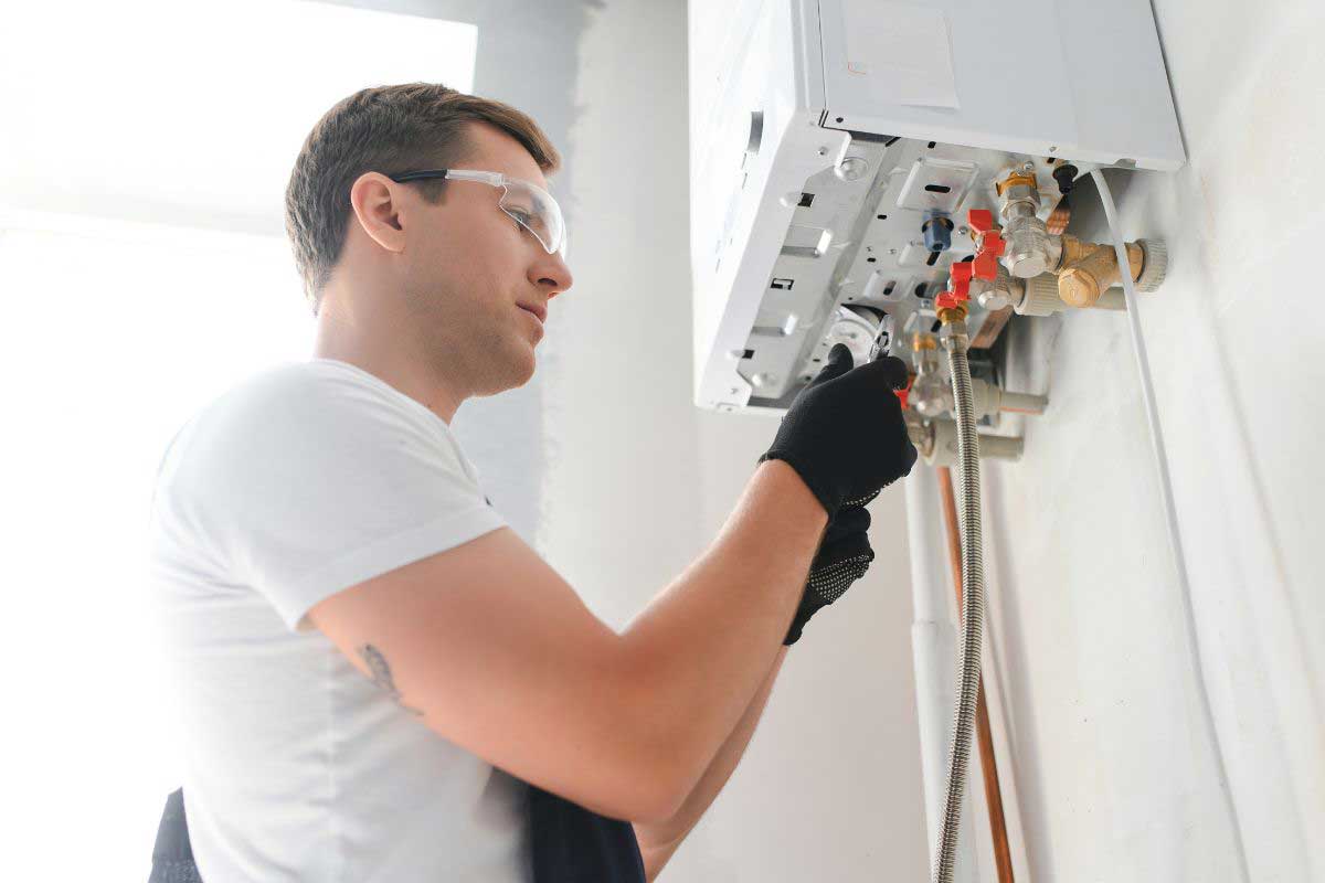 Technician working at boiler