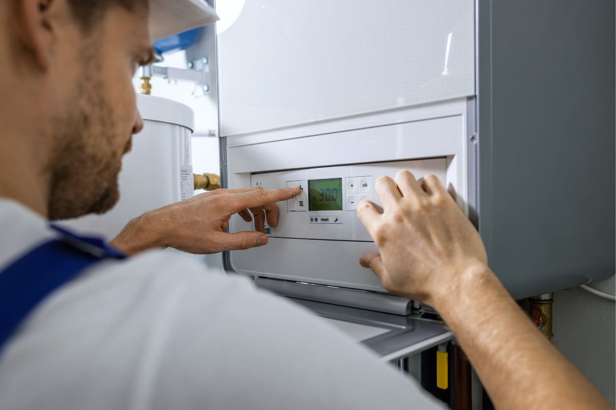 technician checking boiler settings
