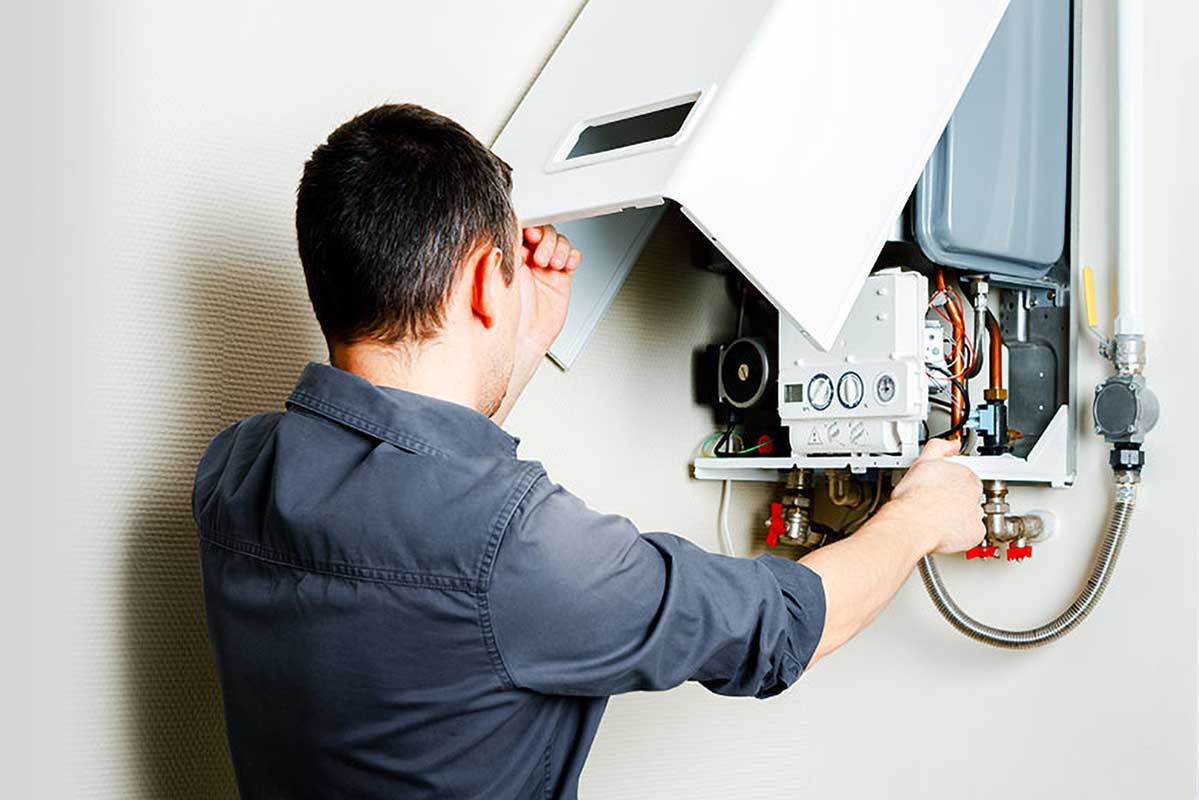 Technician repairing gas boiler